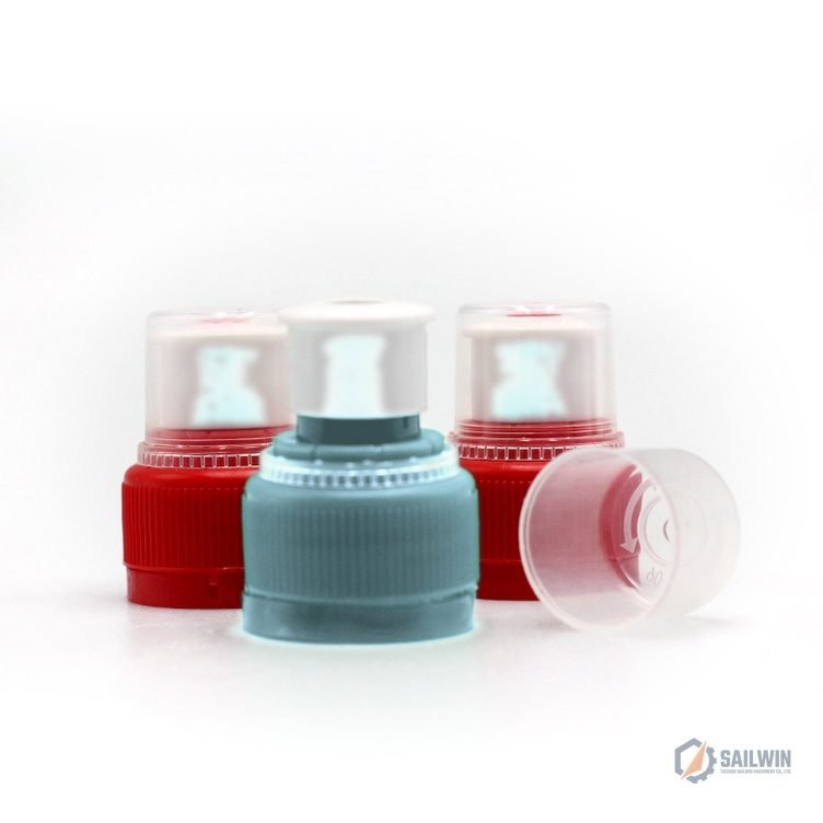 16-cavity combination cap mold assembly in machine bay with distressed blue floor Sailwin