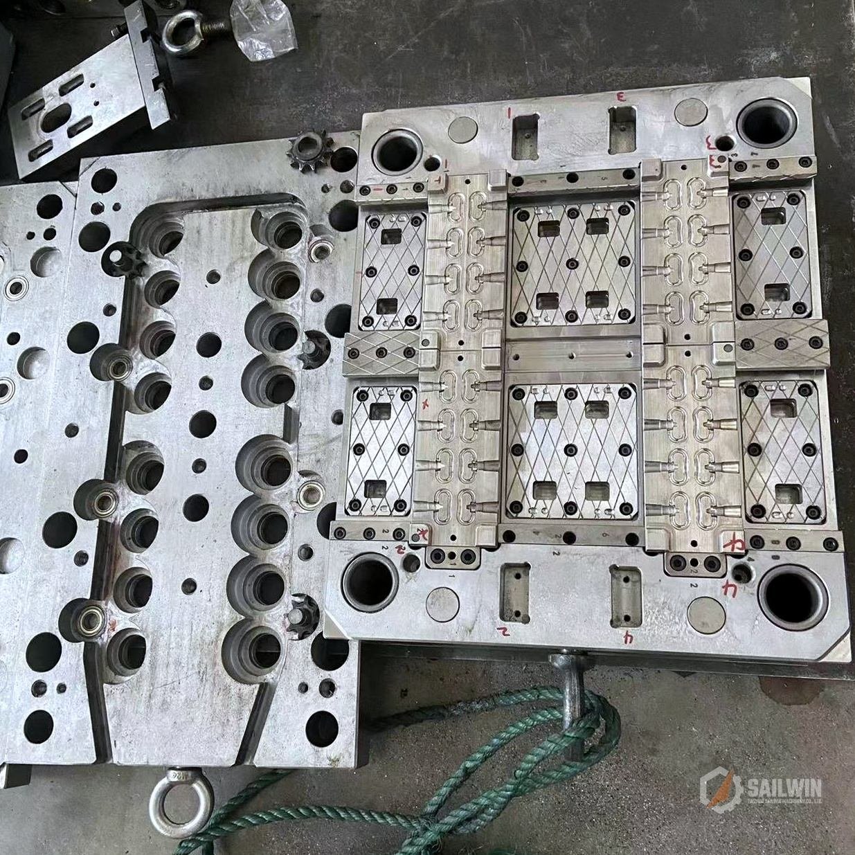 24-cavity edible oil pull-ring cap mold plate with cooling circuits on workshop bench Sailwin