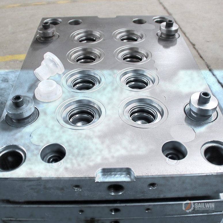 8-cavity oil spout cap cavity plate with translucent pouring plugs on workshop floor Sailwin