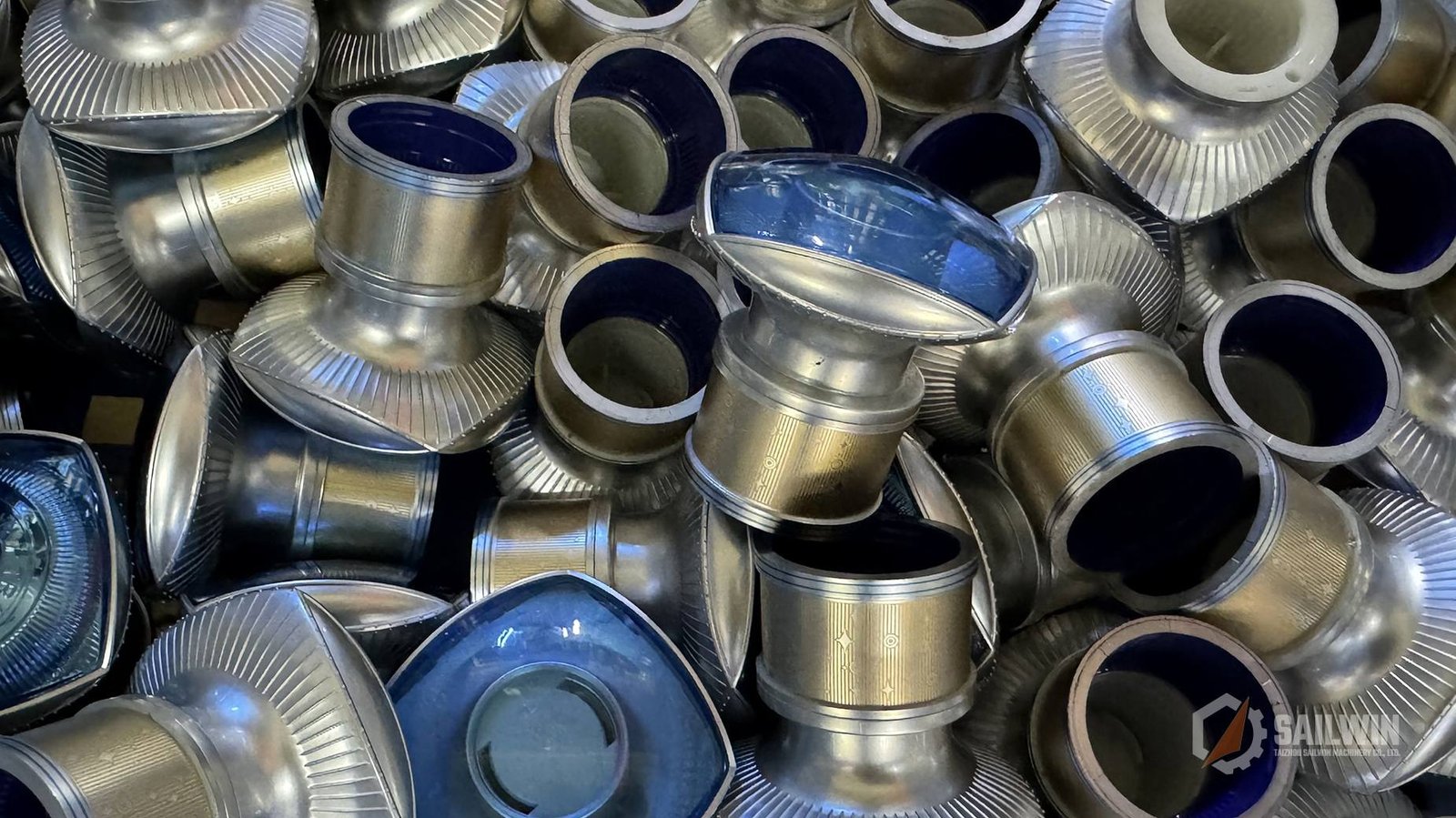 Bulk aluminum wine bottle cap shells and collars in storage hopper Sailwin