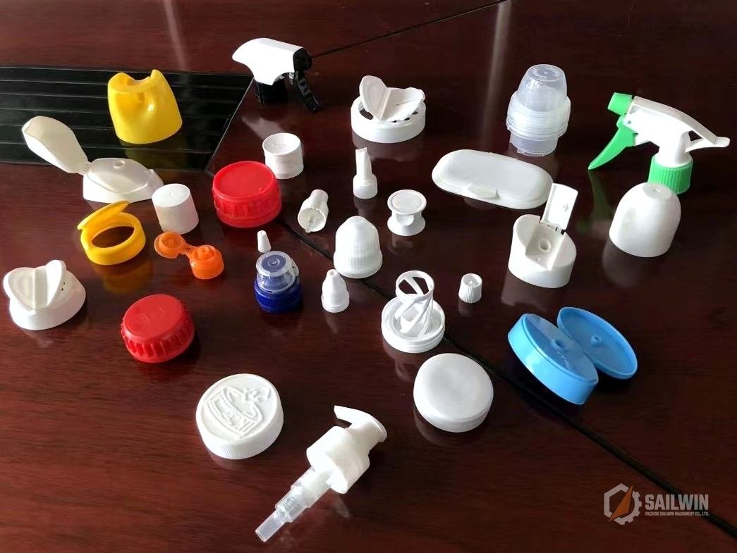 Custom dispensing pumps trigger sprayers and flip-top caps collection on conference table Sailwin