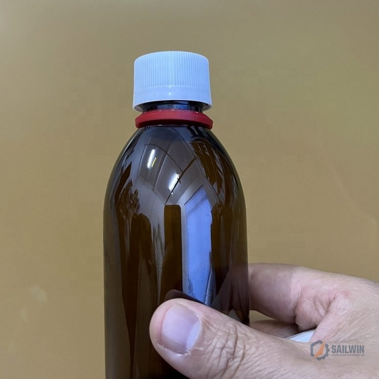 Hand holding sealed amber pharmaceutical bottle with medical safety closure cap Sailwin