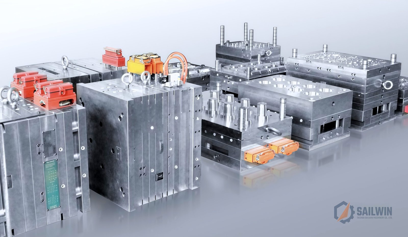 Lineup of multi-cavity plastic cap injection mold assemblies on studio floor Sailwin