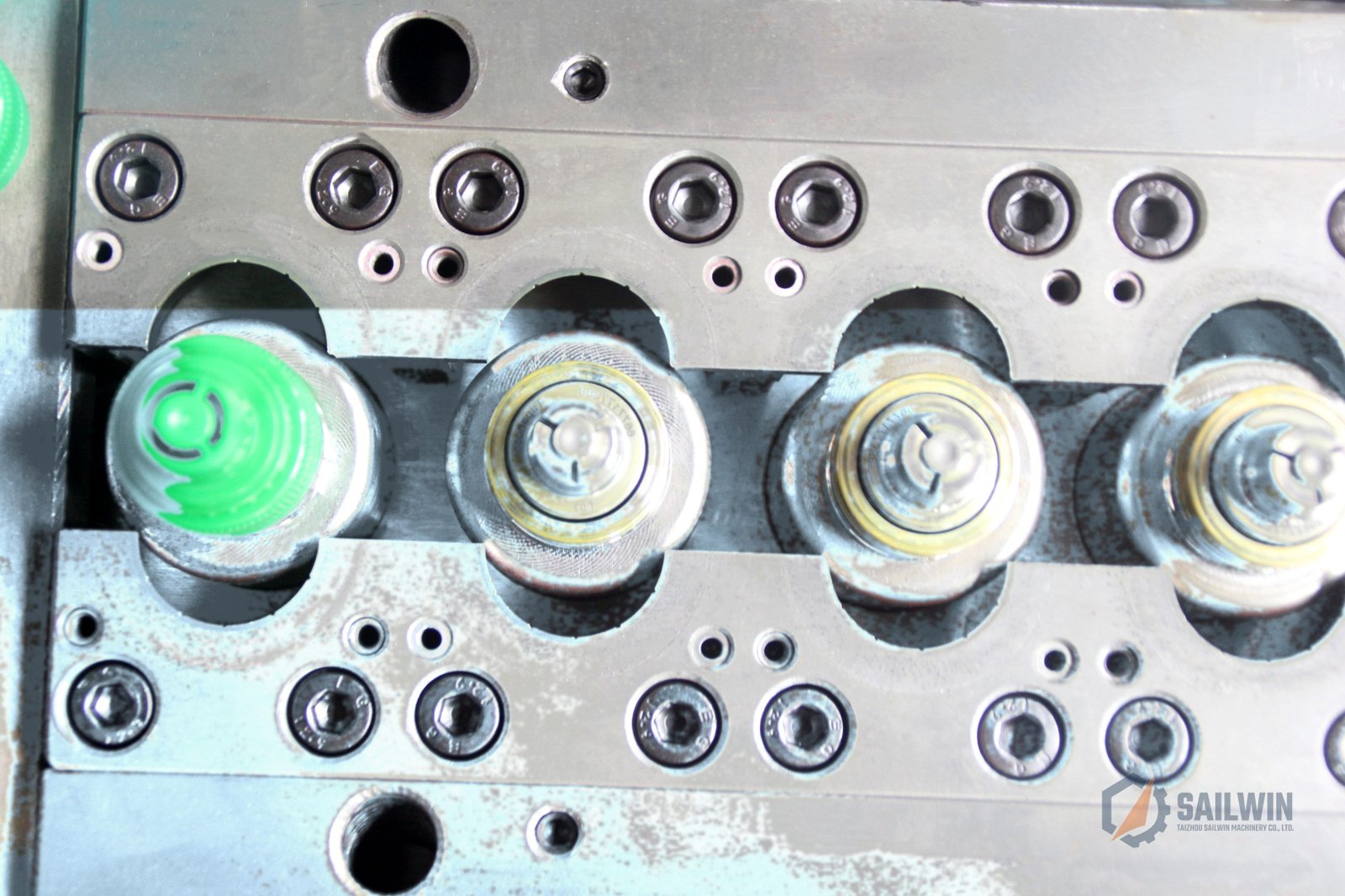 Macro view of sports push-pull cap mold cavities and cores showing sub-micron finish Sailwin