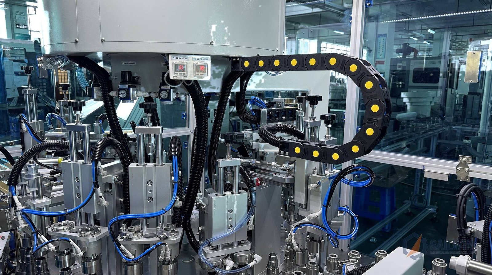 Rotary indexing cap assembly table with flexible cable carrier in workshop Sailwin