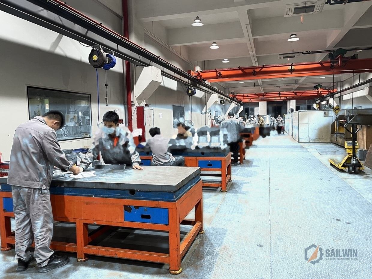 Sailwin mold assembly plant with blue epoxy floor and overhead cranes