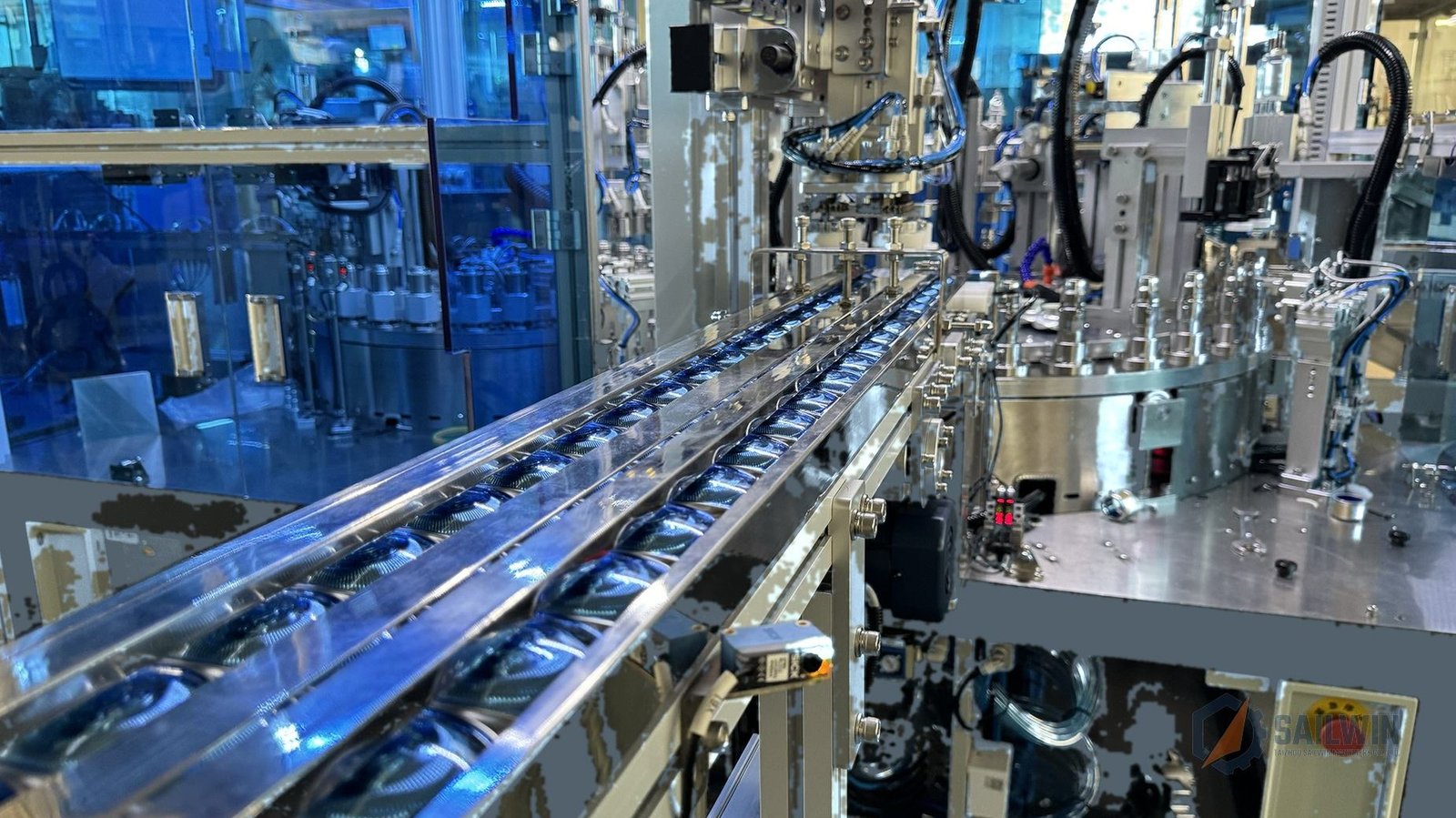Vibratory feeder bowl and parts elevator for wine cap assembly system Sailwin