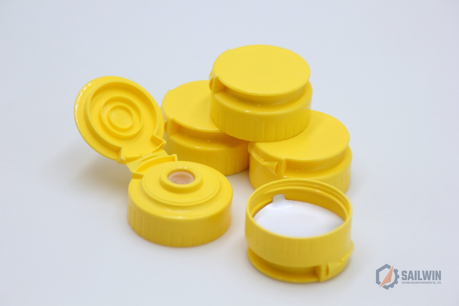 Yellow condiment sauce squeeze flip caps with silicone valve macro shot Sailwin